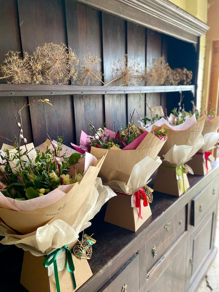 Gift-wrapped Valentines bouquets with British flowers